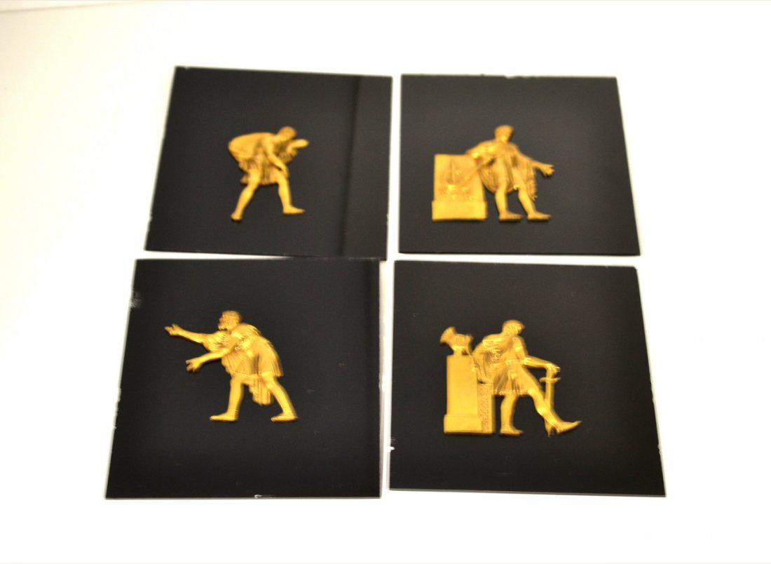 Set of P.E.Guerin Bronze Appliques- Ancient Greeks: Four bronzes, each affixed (removable) to a black glass panel, depicting figure from ancient Greek court scenes. All have been examined by the Guerin Foundry and given a circa date of 1920. Figures fr