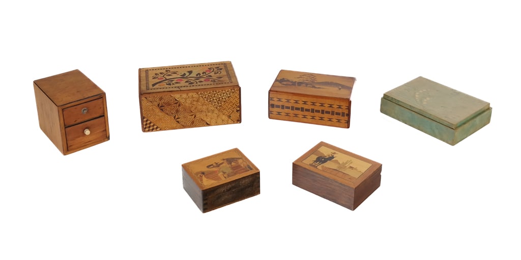 Japanese Yosegi and Other Inlaid Boxes, 6: Six inlaid boxes comprising a Japanese yosegi puzzle box with bird and landscape decoration, a puzzle box with landscape and bird decoration, a green inlaid wood box, a Japanese box with two drawers, 