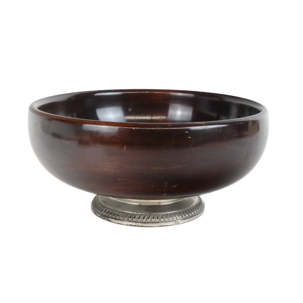 Sterling Silver and Mahogany Center Bowl: Sterling silver and mahogany center / fruit / salad bowl, last quarter of the 20th century, mark to foot rim "sterling" and base. [5" H x 10.75" Diameter]. Overall condition is good, scratches to inte