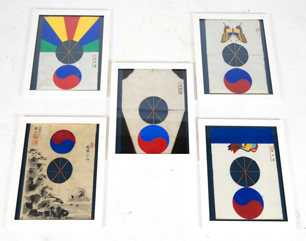 Five Bangpae Yeon Korean Kites in Frames: Five bangpae yeon Korean paper kites, 20th century, in frames, with hand painted decoration on bamboo frames, including one polychrome painted with Korean flag detail, a kite with black and Korean fla