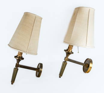 Pair Brass Sconces: Pair of brass sconces with candle covers over a bobesche and a tapered bottom and brass backplates. [Excluding harp: 12" H x 4.5" W x 9.5" D]. Overall condition is good with patina to brass, damage to