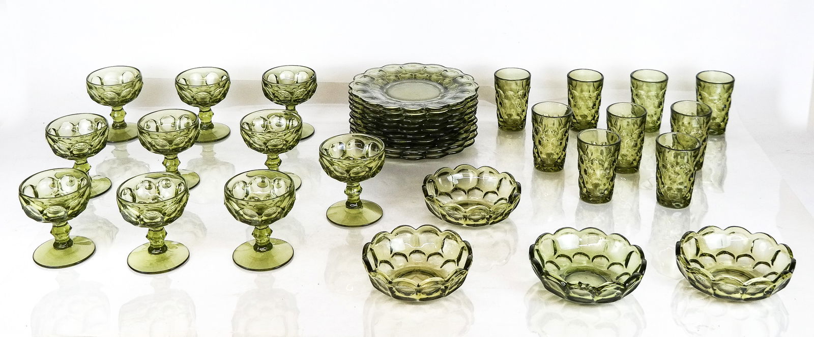 Imperial Glass Ohio Provincial Green Serveware, 32: Imperial Glass Ohio "Provincial Green" serveware comprising nine juice glasses, four finger bowls, nine salad or dessert plates, and ten coupe glasses. [Plates: 8.25" Diameter]. Overall condition is g