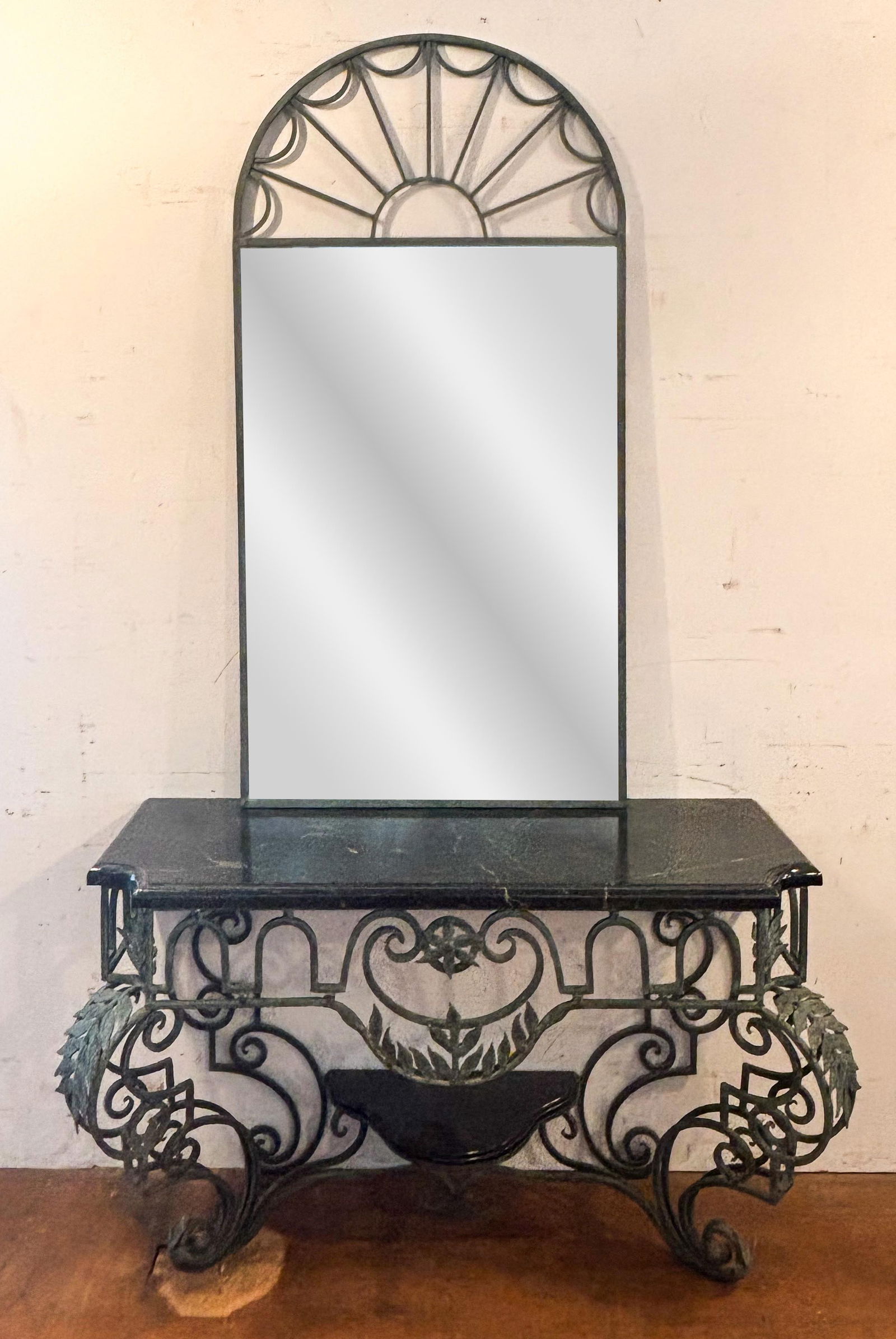 Regency Hollywood Iron and Marble Console with Mirror: Regency Hollywood foliate and scrollwork iron and marble console table and mirror, probably last quarter of the 20th century. [Console: 35" H x 54.5" W x 22" D, Mirror: 66" H x 33.75" W]. Overall cond