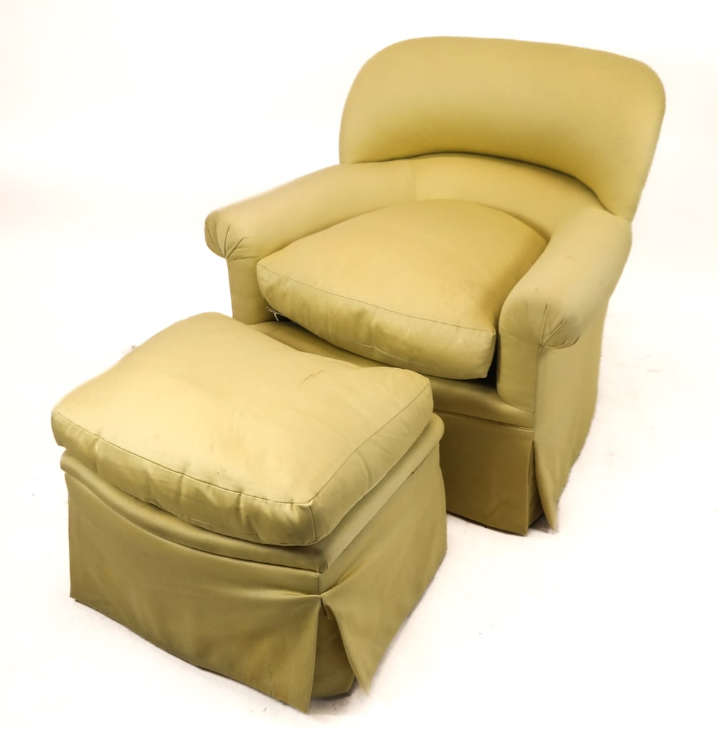 Pale Yellow Upholstered Club Chair and Ottoman: Pale yellow upholstered club chair with ottoman, the ottoman on casters, with hinged top opening to reveal a storage well. [Chair: 33" H 37" W x 32" D19", Height to seat 22", Ottoman: 19" H x 24.5" W 