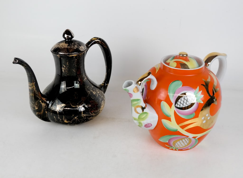 Ayaebo and Sascha Brastoff Teapots, 2: Two teapots comprising a Sascha Brastoff gilt decorated teapot, an Ayaebo porcelain "Leaping Stag" teapot, both with marks to bases. [Ayaebo teapot: 10" H x 14" W x 9" D]. Condition to Ayaebo teapot i