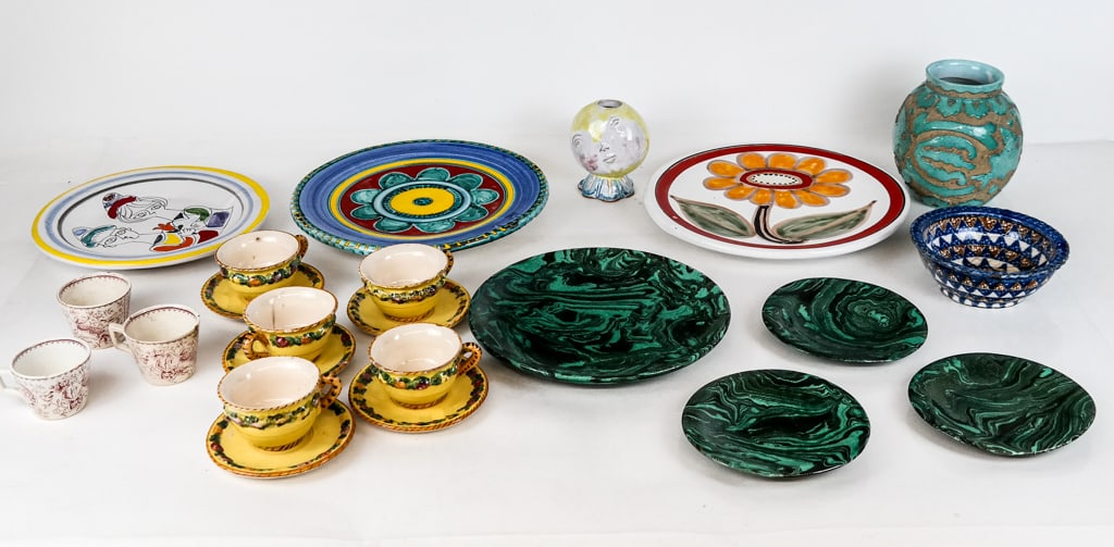 Assorted Italian Majolica and Other Pottery, 23: Assorted Italian majolica and other pottery comprising five Italian majolica demitasse cups and saucers, a DeSimone floral decorated plate, a DeSimone figural decorated plate, a DeSimone floral and po