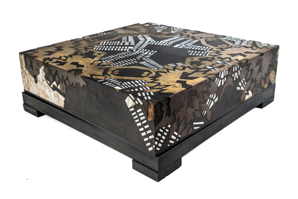 Brass and Mother of Pearl Inlaid Presentation Box: Brass and mother of pearl inlaid presentation box, possibly Japanese, with a velvet pad to interior, on feet, unmarked. [5.75" H x 16" Square]. Condition is good to fair with lifting to veneer and inl