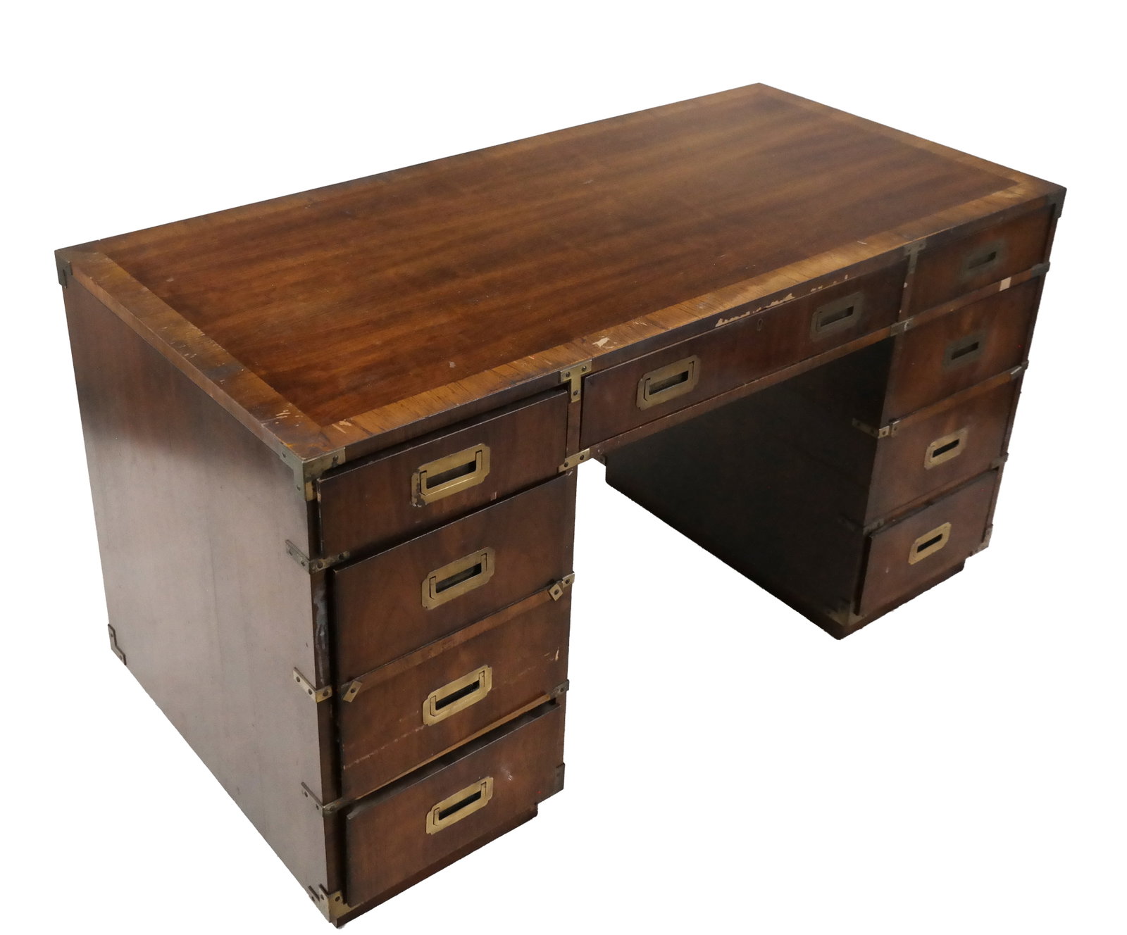English Campaign-Style Desk: English campaign-style desk, 20th century, having cross-banded top and drawer fronts, with brass handles. [30" H x 54" W x 26" D]. Fading and chips to veneer top center and side drawers.