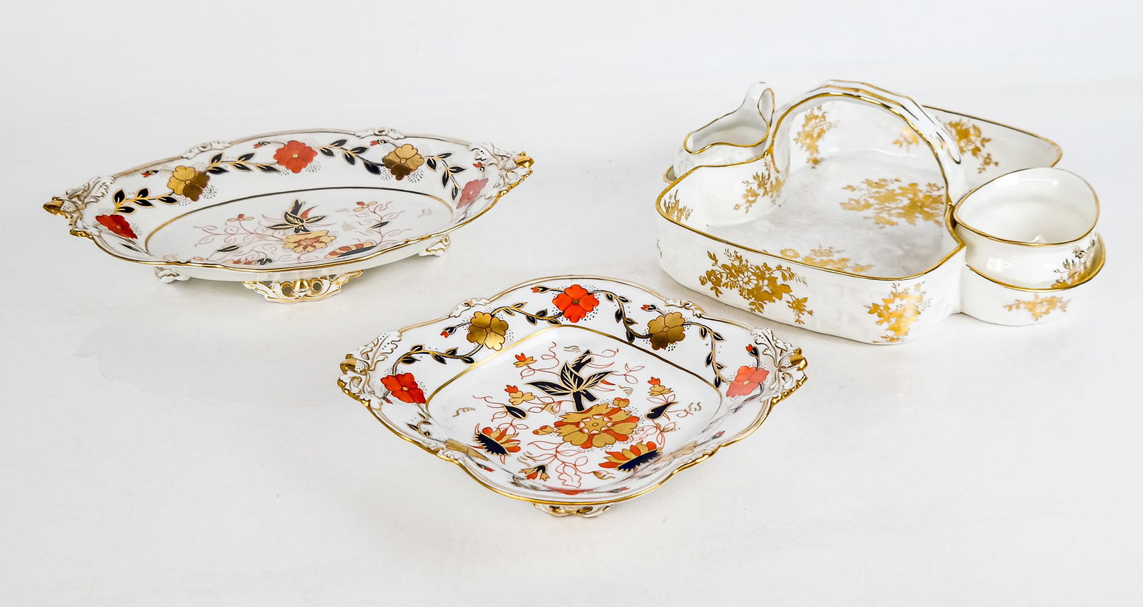 Tiffany & Co. Bone China Serve Wares, 3: English bone china for Tiffany & Co. comprising two Royal Crown Derby for Tiffany & Co. dishes in the Asian rose pattern including a footed serving dish and an oblong footed serving dish, and a strawb