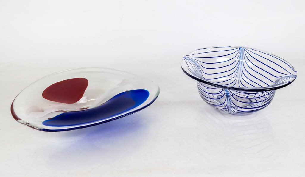 Erik Hoglund and Other Art Glass Bowls, 2: Two art glass bowls comprised of a blue feathered glass bowl, monogrammed M to base, and an Erik Hoglund art glass dish with signature and dated 1991. [Feather glass bowl: 4.5" H x 10" Diameter]. Cond