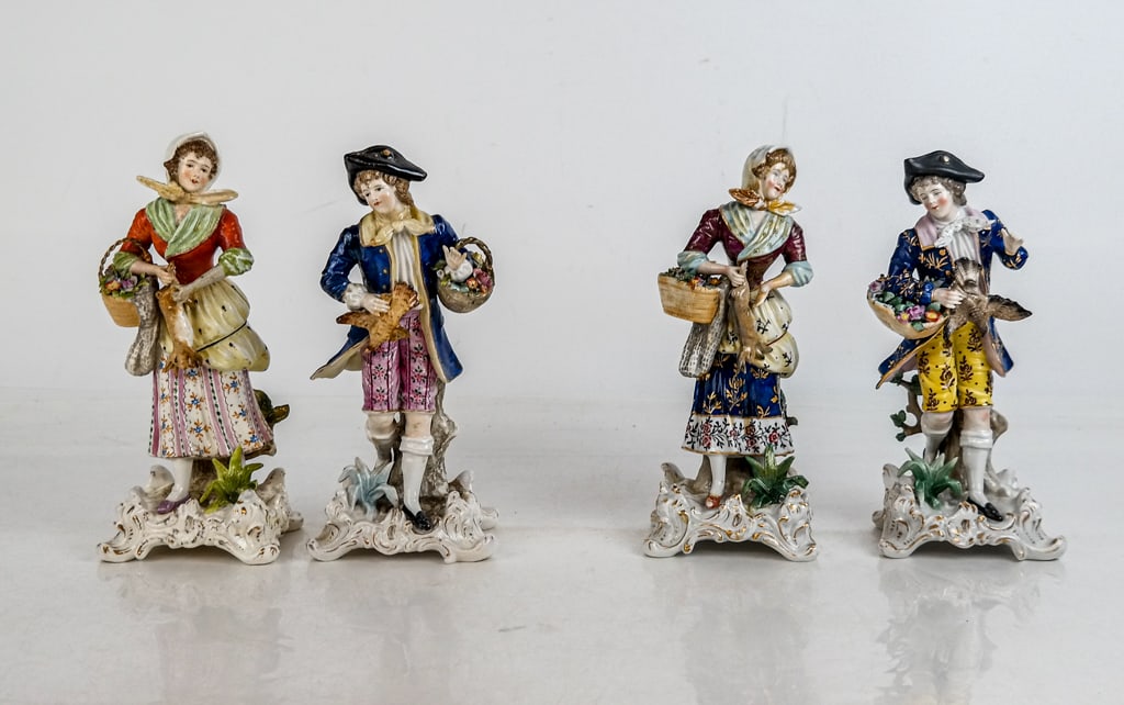 Matched Pairs Capodimonte & Other Porcelain, 2: Two matched pairs of porcelain and polychrome painted figurines comprising a Capodimonte marked figure of a woman, and an unmarked figure of a woman, and a Capodimonde figure of a man, and an umarked