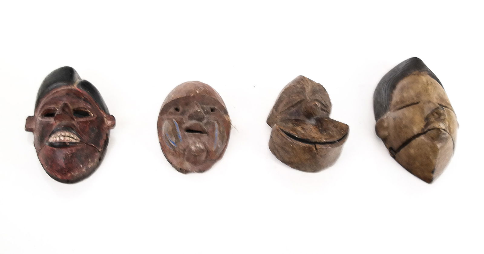 4 Diminutive Carved African Masks (1 of 18)