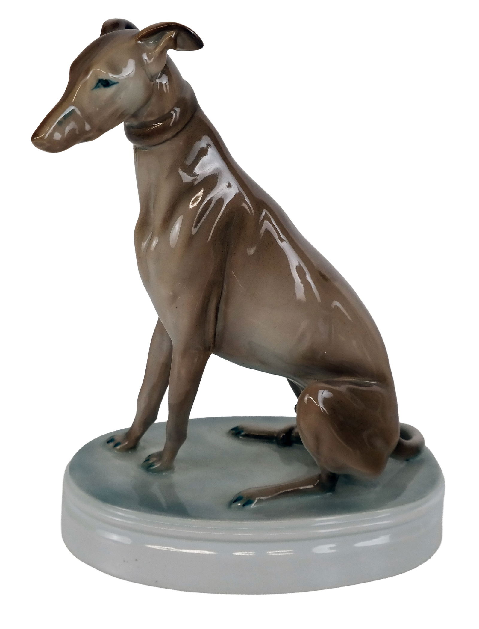 Zsolnay Porcelain Greyhound Figurine: Zsolnay porcelain greyhound figurine, circa 1970-1980, mark to base. [10" H x 4.5 " W x 7.5" D] Overall condition is good. From the esteemed collection of Neil Zukerman former owner CFM Gallery