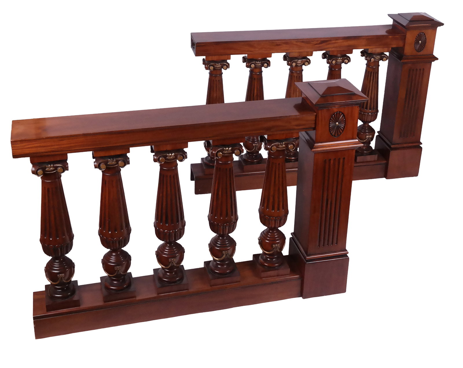 Pair Carved Mahogany & Gilt Decorated Balustrades: Pair of carved and gilded mahogany balustrades with ionic columns, fluting and rosette details. [Each 43" H x 60" W x 10.25" D]. Overall condition is good/fair, abrasion and wear on corners, one with 