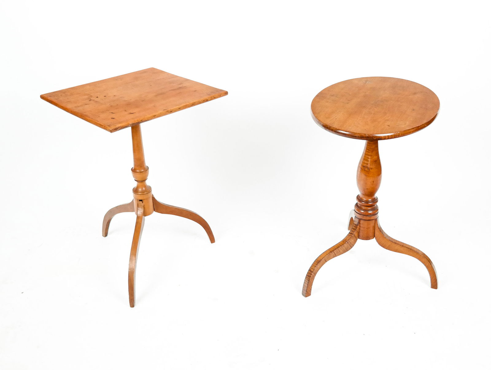 Two Tea Tables: Two tea tables, 19th century, comprising a tiger maple tea table with an oblong top on tripod legs, and a square top tea table on tripod legs. [Taller: 26.25" H x 18" Square]. Condition is good with m