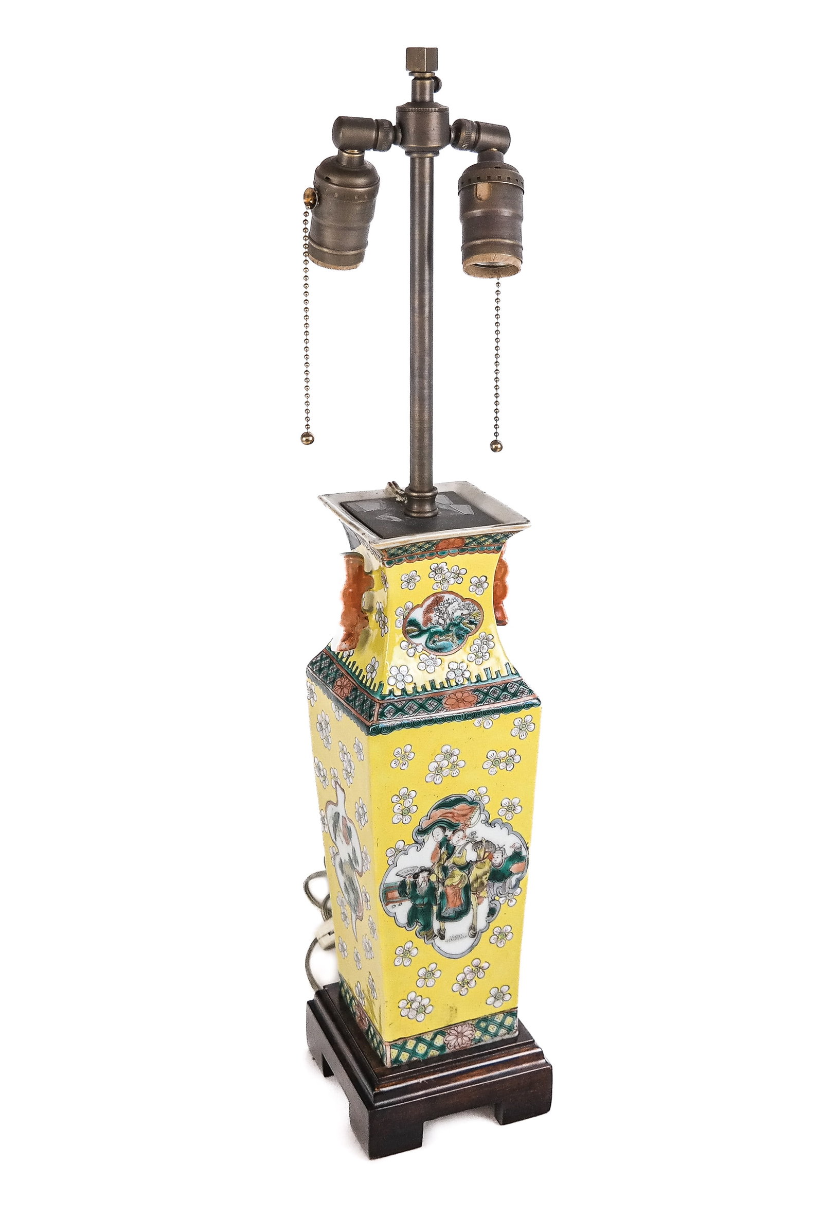 Chinese Famille Jaune Vase Mounted as a Lamp: Chinese Famille Jaune vase, likely Qing Dynasty, mounted as a two light lamp on a wooden stand with two handles and figural cartouches to two sides. [To lip of vase: 13.5" H x 4.5" Square]. Condition 