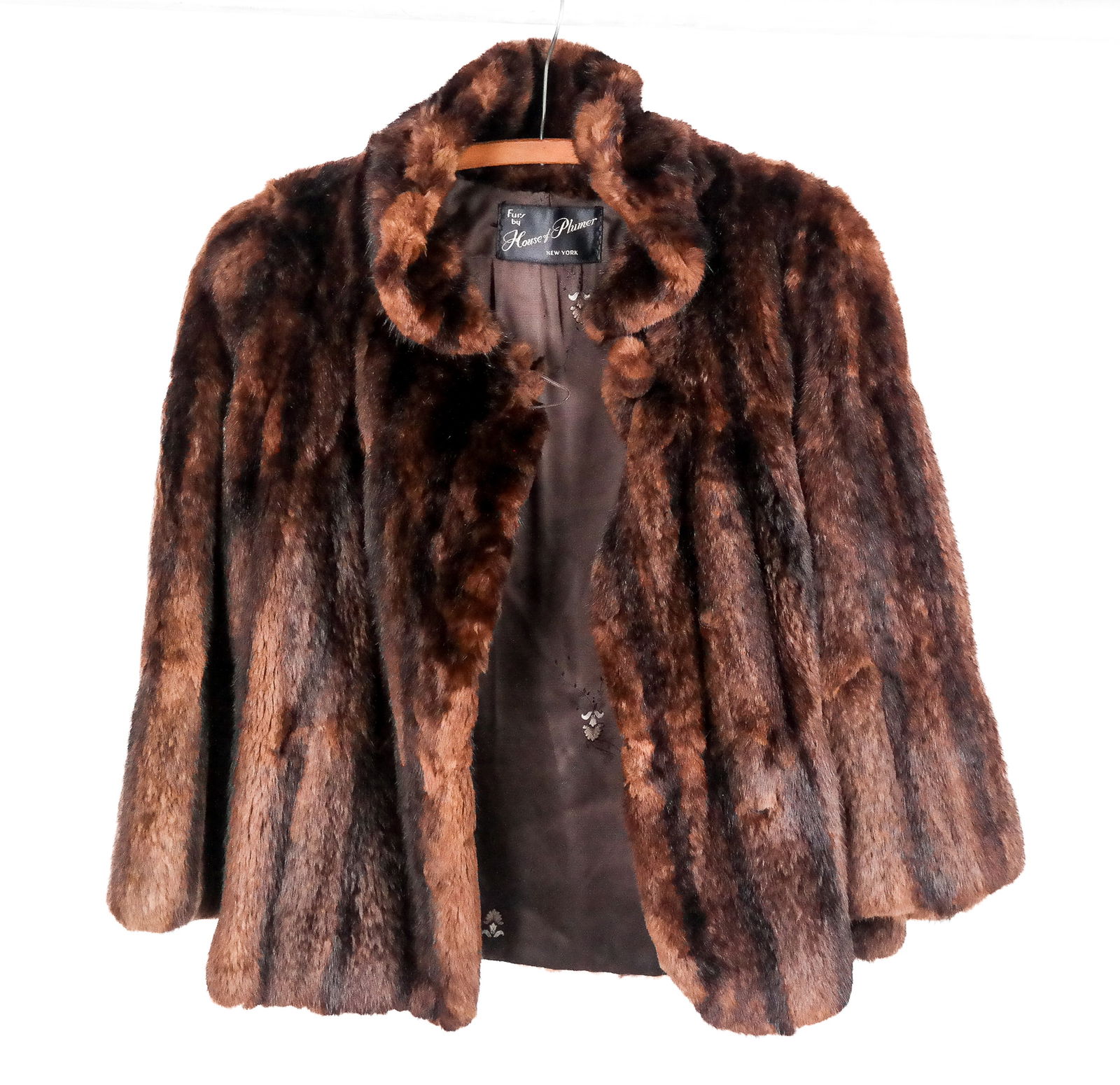 House of Plumer Mink Jacket: House of Plumer mink jacket with floral printed lining, a button to upper, and hook and eye closure, with label to interior. [Neck to hem: 25"; shoulder to shoulder: 18.5"; bust: 20"; sleeve: 20"]. Co