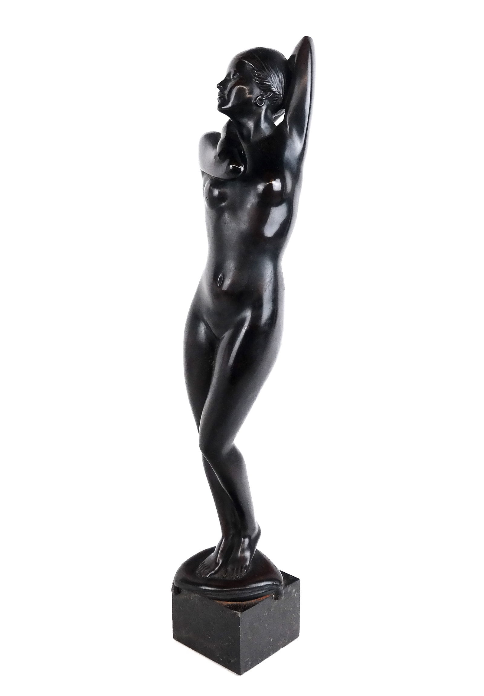 Ulfert Janssen Nude Figural Bronze on Marble: Ulfert Janssen (German, 1878-1956) nude figural bronze of a woman standing on a pillow mounted on a marble base, signed U. Janssen to lower reverse. [18" H x 3.25" W x 3.25" D]. Condition is good with