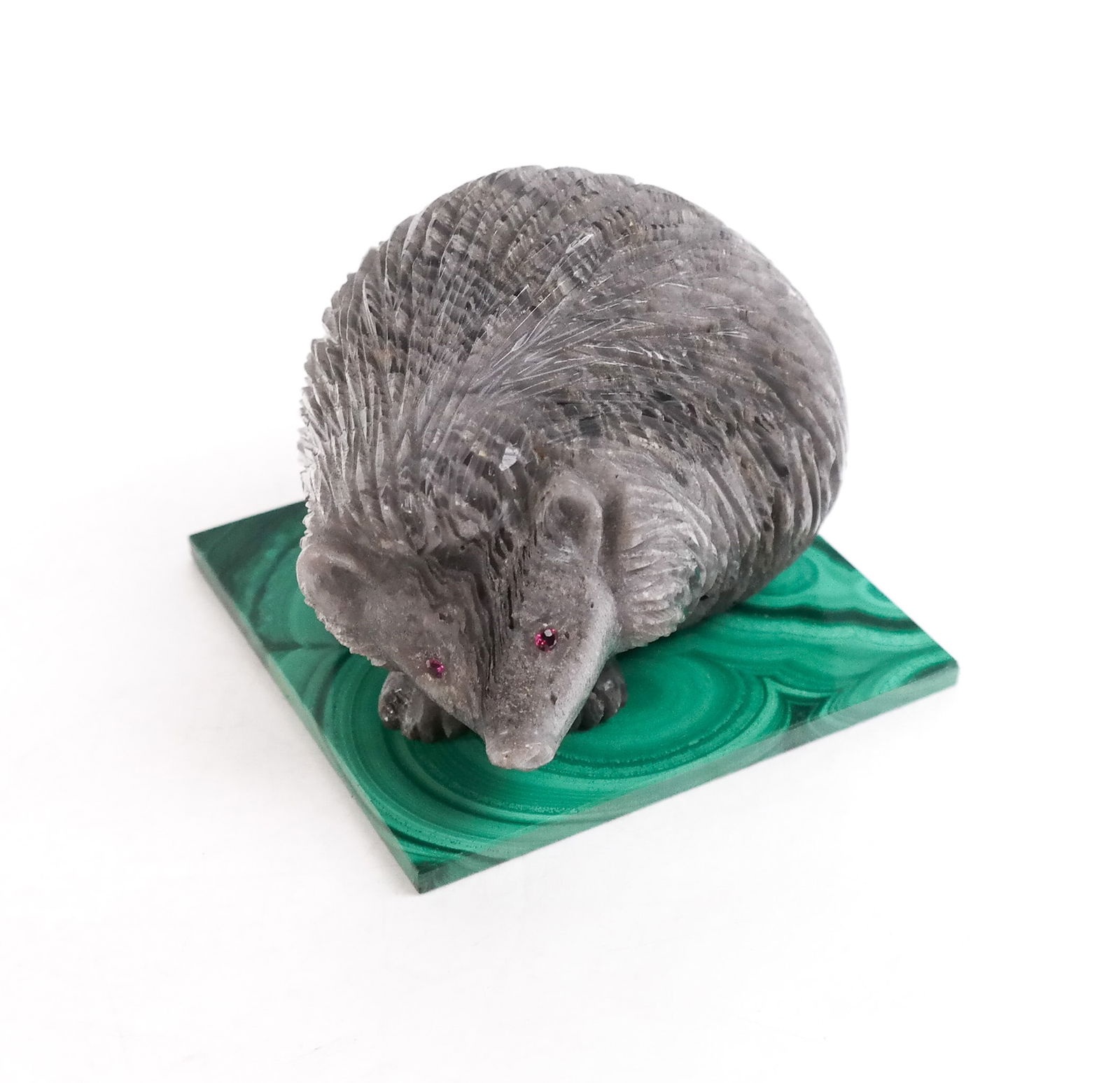 Whimsical Carved Hedgehog on Malachite Plinth: Whimsical carved hedgehog on malachite plinth. [2" H x 2.75" Square]. Overall condition is good.