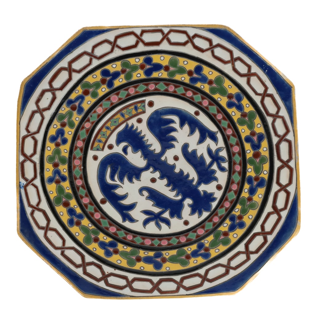 Heraldic Octagonal Charger: Heraldic octagonal charger, 20th century, with a central crest surrounded by repeating hand decorated design, with a yellow border, with holes to foot for wall-mounting, unmarked. [16" Diameter]. Cond