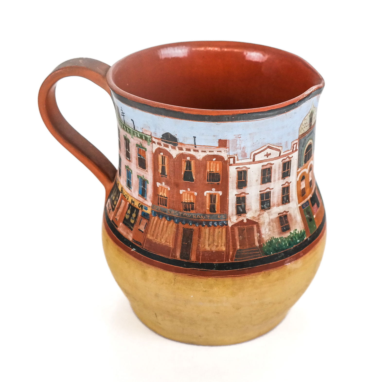 Lidya BUZIO Hand Painted Terra Cotta Ewer: Lidya Buzio (Uruguay/United States 1948-2014) hand painted terra cotta ewer, 1977, with a street scene and glazed to interior, dated and signed Buzio NY with the artist's cipher. [6.25" H x 7.5" W x 5