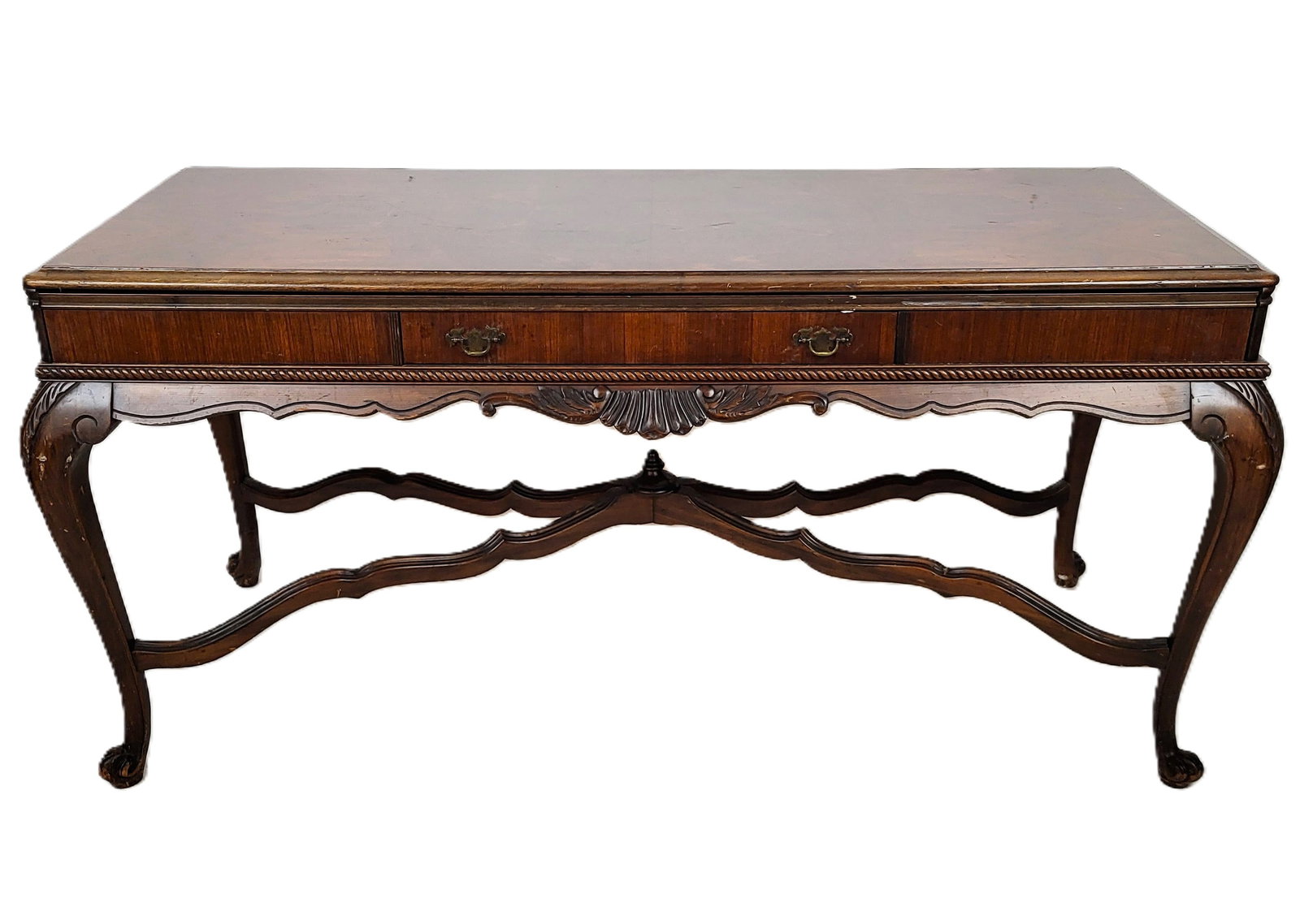 Carved Mahogany Extendable Bureau Plat: Carved mahogany extendable bureau plat, 20th century, with book matched flame mahogany to upper, over a carved apron and cabriole legs terminating in paw feet, a drawer two one side, and extendable sl