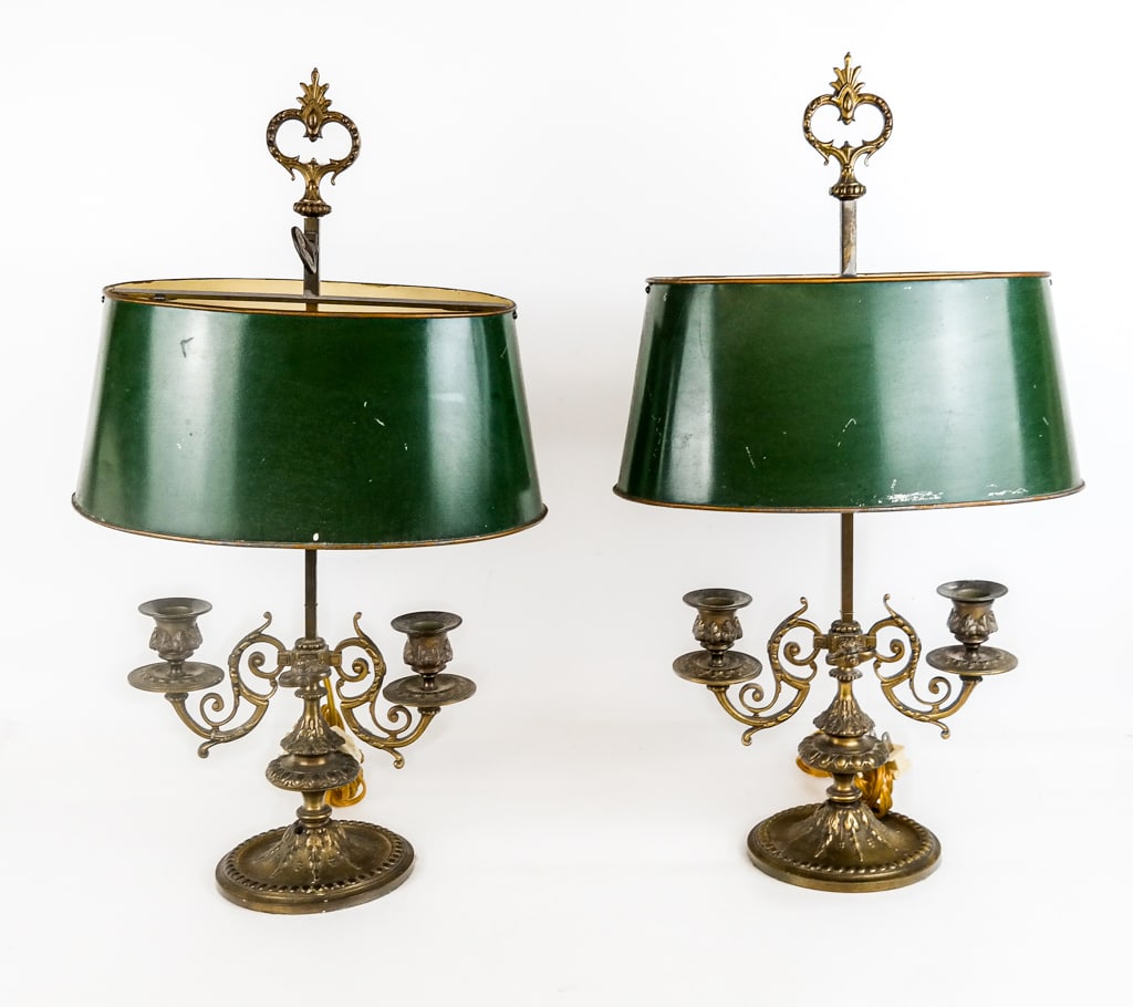 Pair of Gilt Bouillotte Lamps: Pair of gilt metal bouillotte lamps, 20th century, with green told painted shades and candelabra form bases. [21.5" H x 12.25" W x 8" D]. Condition to each is good with minor wear; wiring untested. Fo