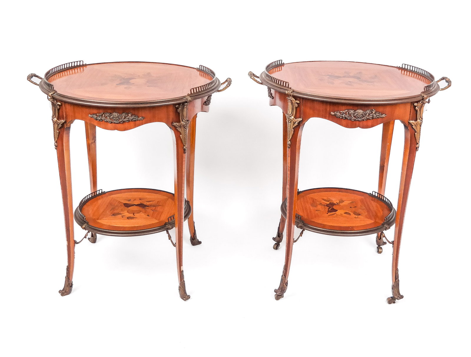 Pair of Louis XVI Marquetry Inlaid Tables: Pair of Louis XVI marquetry inlaid tables, 20th century, with tulipwood veneer and fruit decoration and two partially galleried tiers, the upper with handles. [28.5" H x 27' w x 23" D]. Condition to e