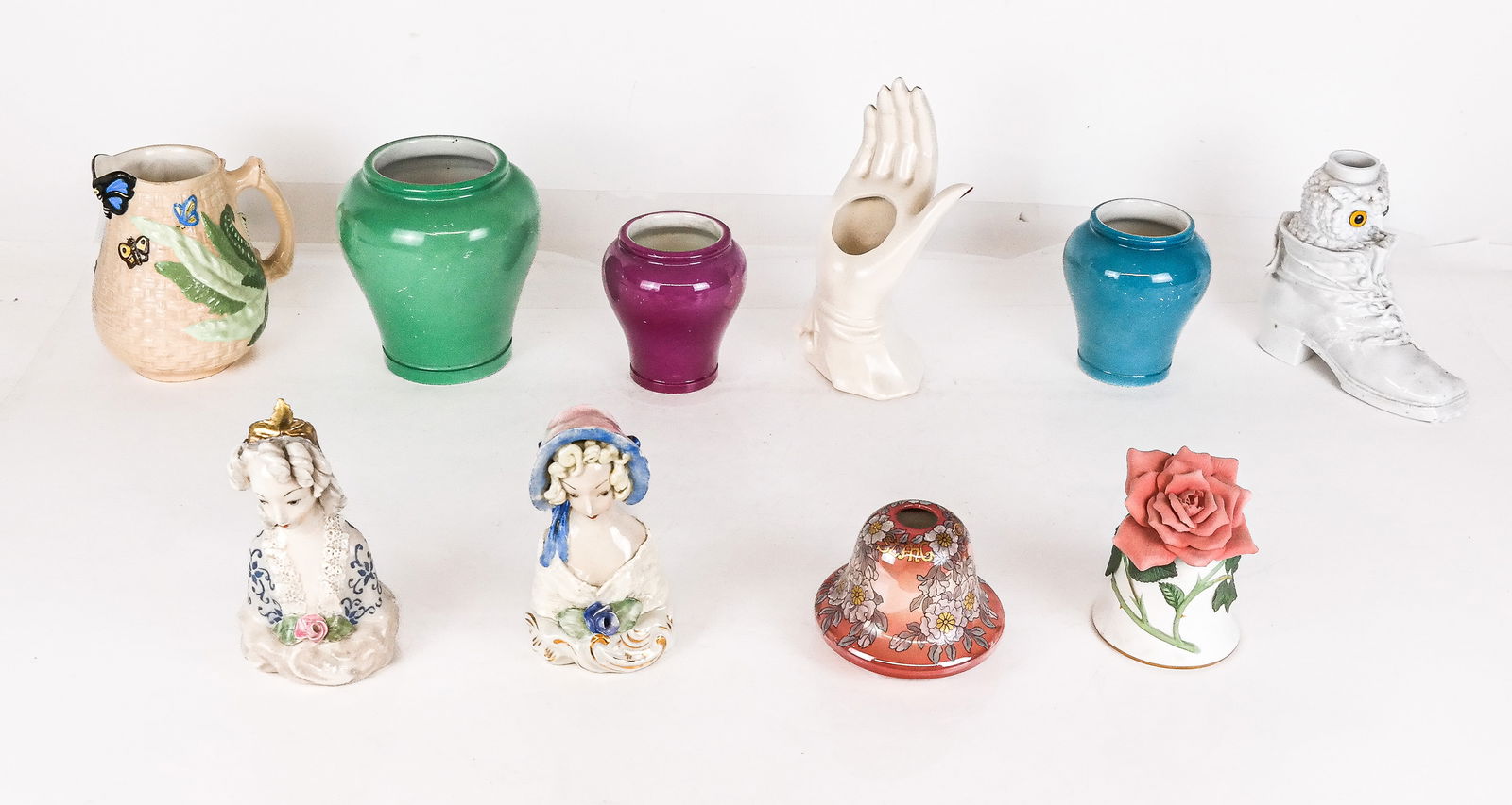 Ten Assorted Porcelain Decorative Wares: Assorted decorative porcelain wares, comprising a blanc de chine owl and shoe form flask, a Frank Beardmore and Co Fenton Glasian ware bud vase with inscription to bottom, a floral decorated bone chin