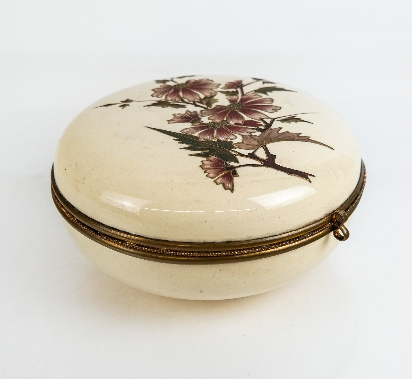 Floral Decorated Porcelain Box: Floral and moriage decorated porcelain box with a gilt metal accent, unmarked. [4.25" H x 9" Diameter]. Condition is good with minor losses.