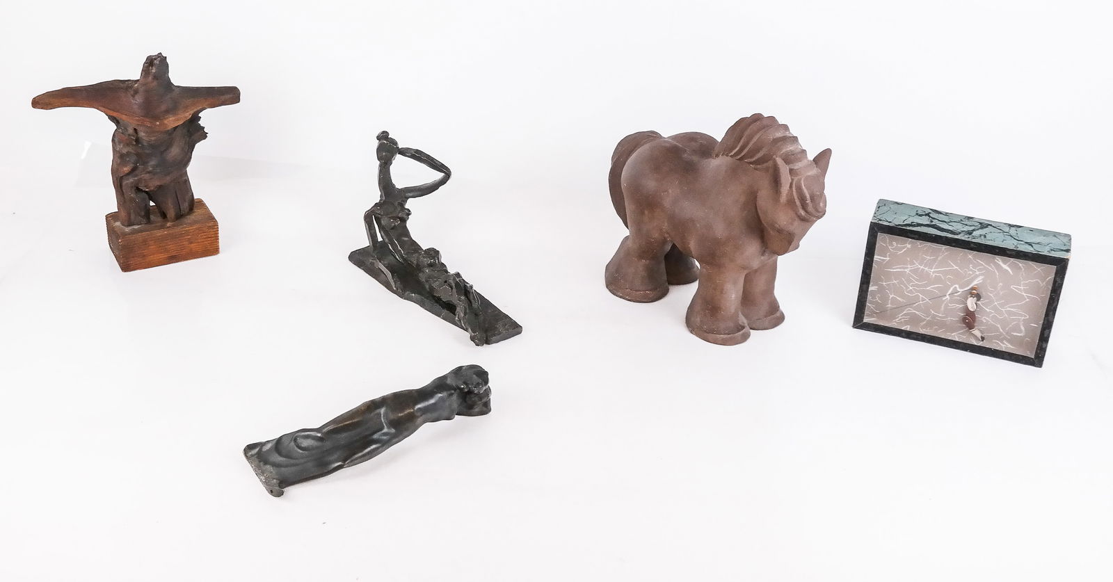 Five Assorted Decorative Objects: Five assorted decorative objects comprising an Art Deco patinated bronze figure of a woman with a cat at her shoulder, unmarked and less original base, a bronze brutalist reclining figure, a found obj