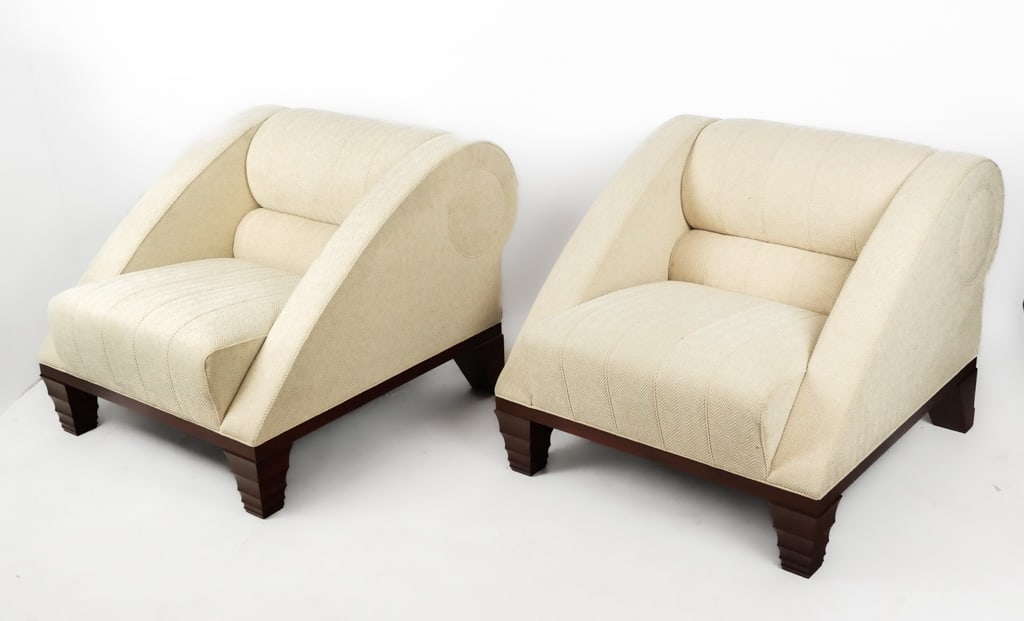 Leon Krier for Giorgetti Pair, "Aries" Club Chairs: Leon Krier for Giorgetti Pair of "Aries" cream colored upholstered club lounge chairs, bearing label to underside. [28" H x 32.25" W x 39" D]. Overall condition is good.