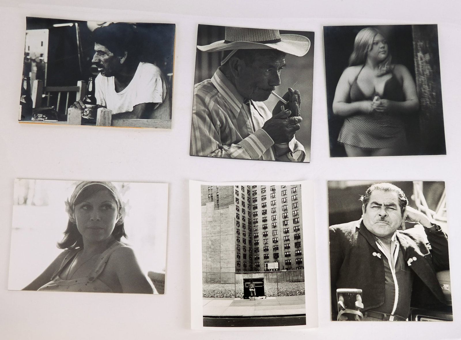 Hans LUX: 6 Black and White Photographs: Hans Lux (German) group of six photographs from his portfolio including A Man with a Beer "La Perla", Portrait of a Woman "Acapulco 1975", A Woman Wearing a Necklace, A Man Smoking, A Figure at a Pian