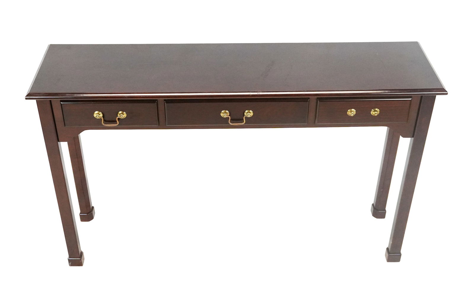 Contemporary Mahogany Three-Drawer Console: Contemporary mahogany three-drawer console, mid- to late 20th century. [30" H x 48" W x 12" D].