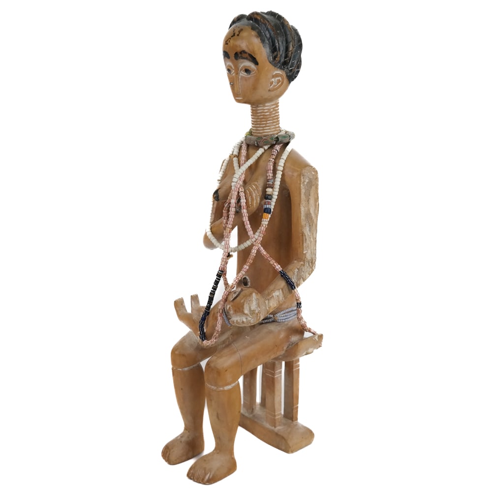 West African Hand-Carved Mother & Child: Hand-Carved Seated Figure of a Mother and Child, 20th century, likely from West Africa, possibly associated with the Akan people. Depicts the mother seated upon an Akan bench, having painted coiffure 