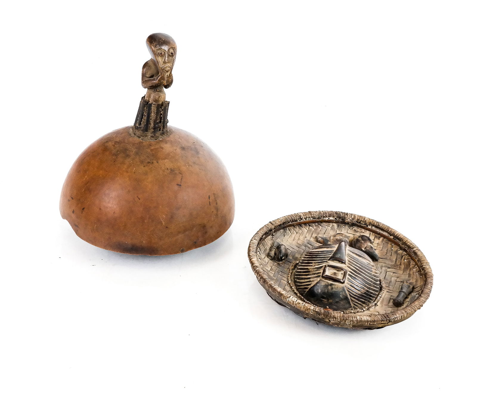 2 Unusual & Rare Central African Articles: Two Unusual and Rare Central African Articles, including: a Fang gourd rattle / musical instrument with carved figure atop the domed structure, having a woven basket underneath with seeds within, Gabo