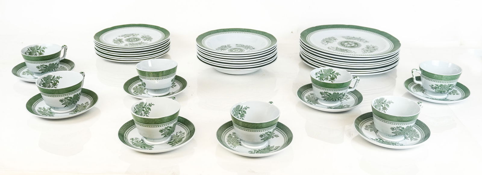 Copeland Spode "Fitzhugh" Partial Service, 41: Copeland Spode green Fitzhugh partial stoneware service, 20th century, comprising eight teacups, eight saucers, eight soup bowls eight salad plates, and nine dinner plates. [Dinner plates: 10.25" Diam