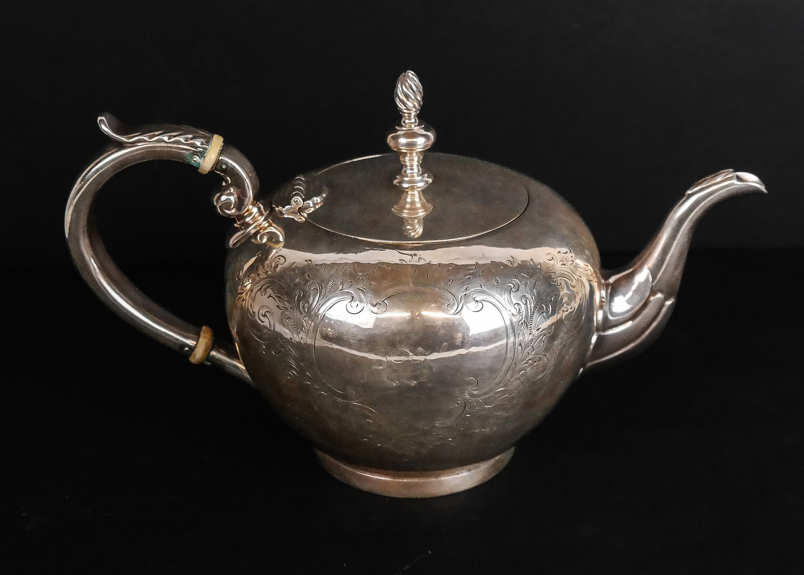 Bigelow, Brothers & Kennard Pure Silver Coin Teapo: Bigelow, Brothers and Kennard pure coin silver teapot, Boston, circa 1860, with flame finial, acanthus handle decoration and collars, the squat body with engraved decoration, marks to base. [16.5 ozt.