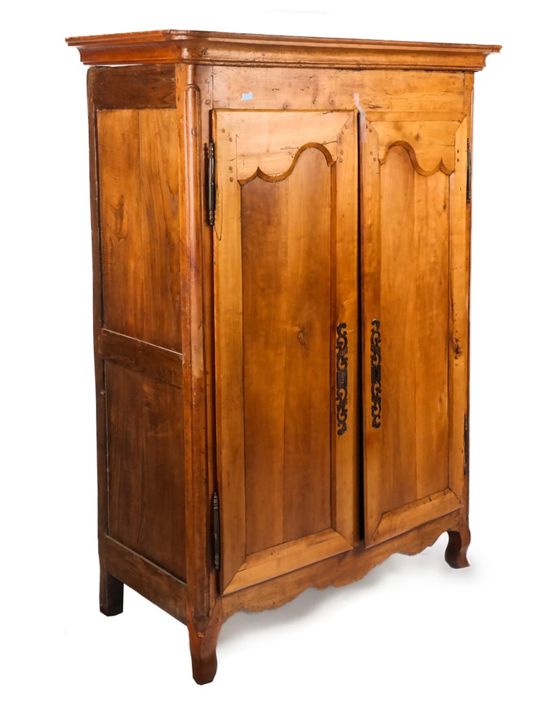 Antique French Provincial Armoire: Antique French Provincial armoire, 19th century, with two decorated doors with iron escuteons and three shelves and a drawer to interior, on cabriole legs; key present. [69.25" H x 46" W x 24" D]. Con