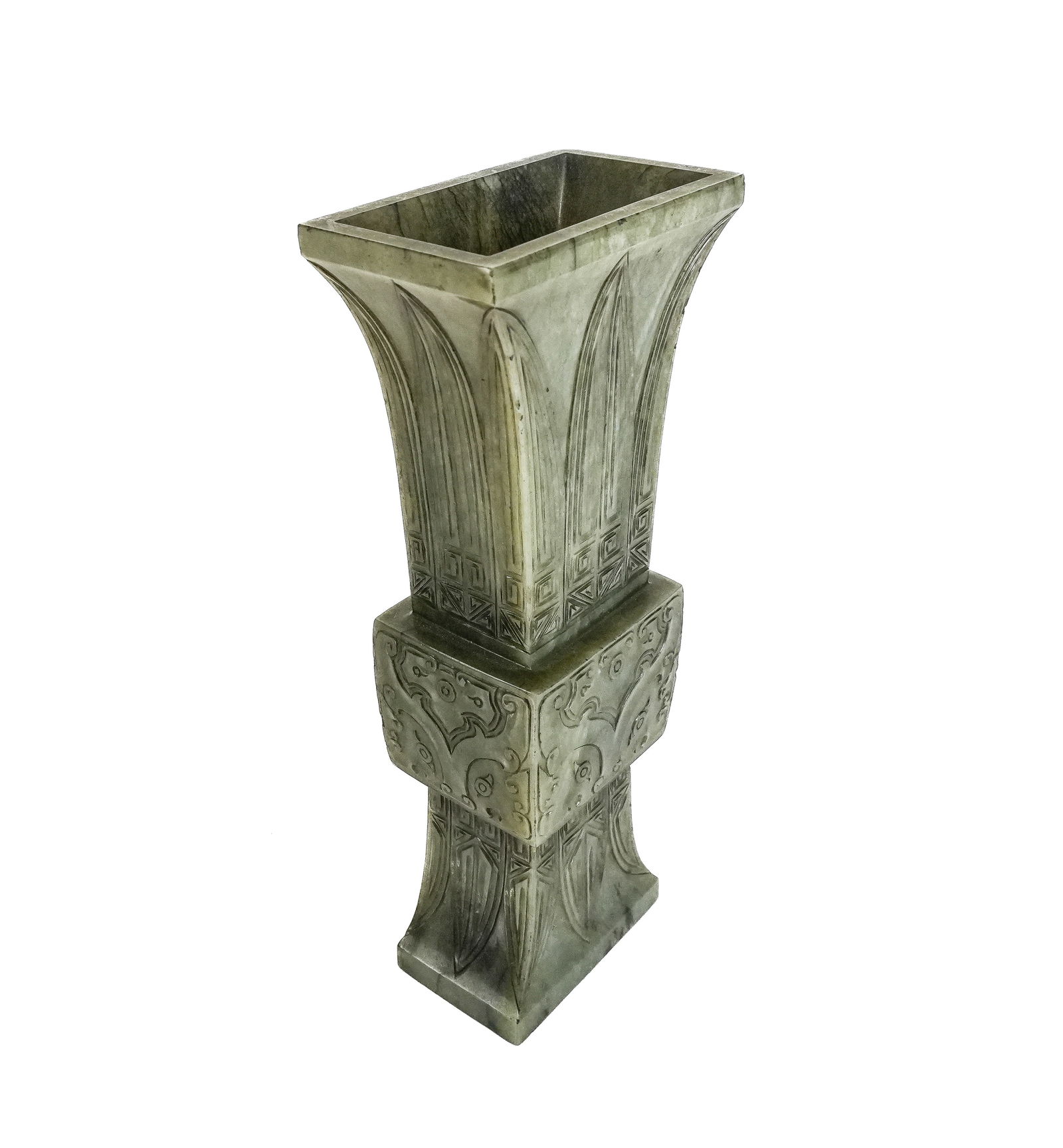 Chinese Jadeite Gu Vase with Taotie Decoration: Chinese jadeite gu vase, 20th century, with archaistic form and taotie decoration. [7.5" H x 3.25" W x 2" D]. Condition is good with a chip at upper.