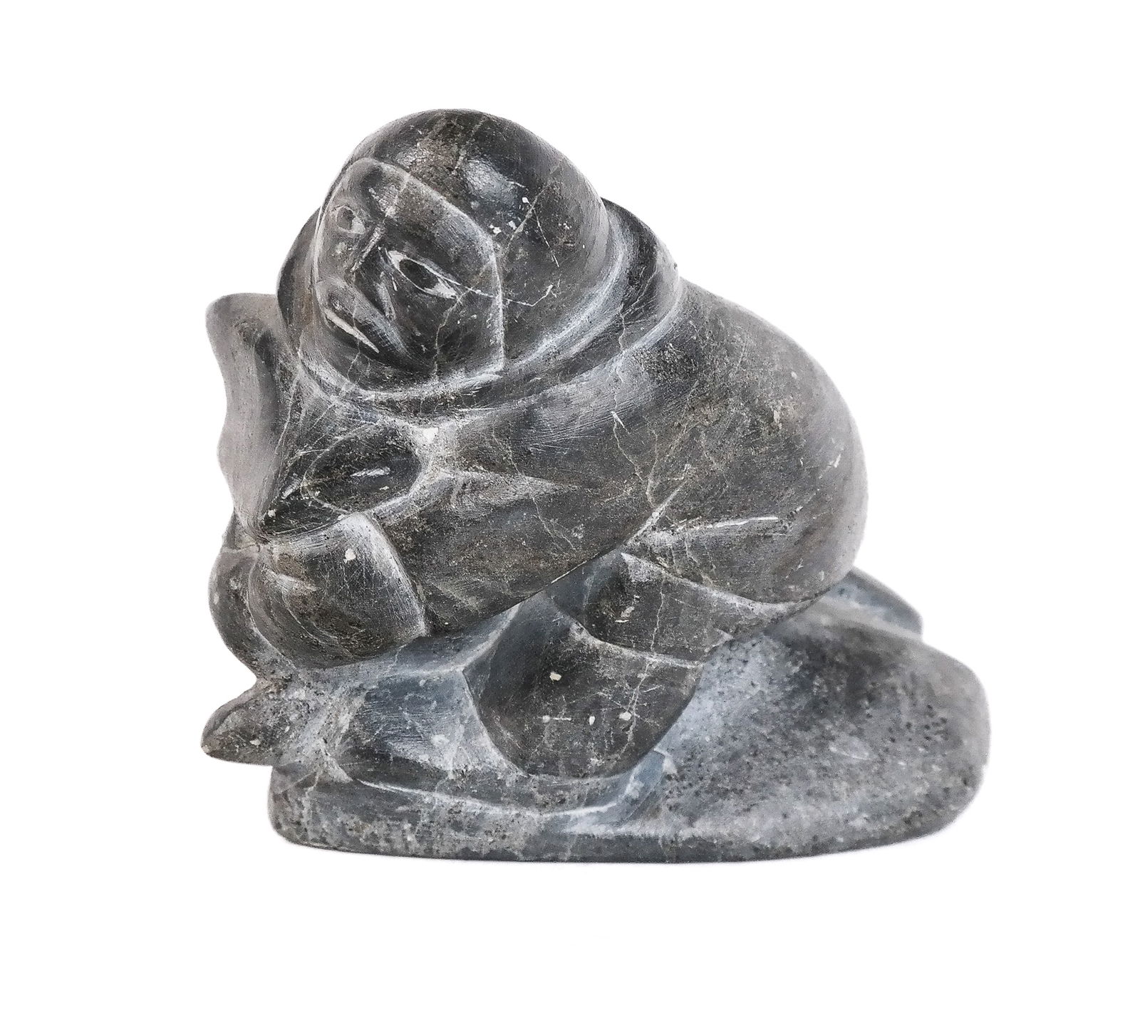 Nowya QINUAJUA Carved Soapstone Sculpture: Nowya Qinuajua (American, Inuit, b. 1923) carved soapstone sculpture, 1946, signed and dated to base. [4.5" H x 6.5" W x 2.5" D]. Condition is good with some wear commensurate with age