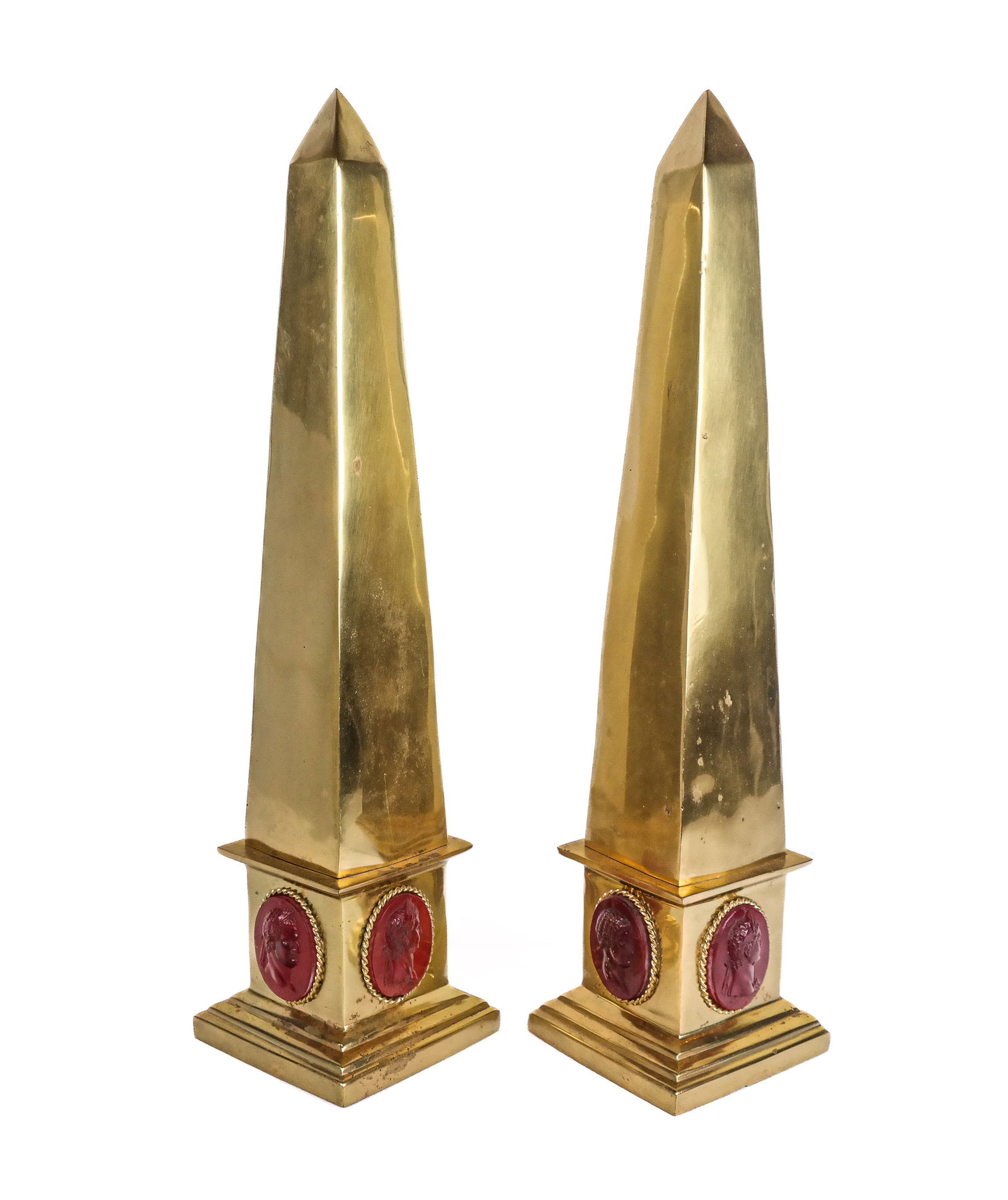 Pair of Gilt Bronze and Faux Carnelian Obelisks: Pair of gilt bronze obelisks accented with faux carnelian cameos of portraits of Augustus Ceasar, Titus, Marcus Salvious Otho, Aulus Vitellius, Constantine II, etc., cameos engraved with names. [18.5"