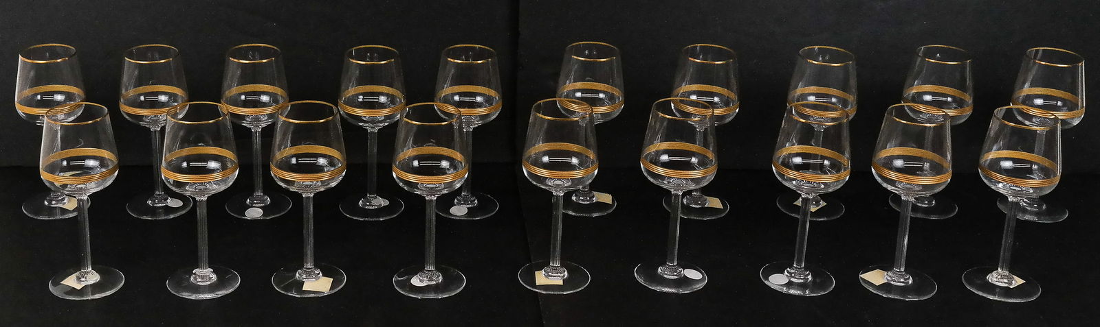 Baccarat "Athena" Gilt Crystal Wine Glasses, 19: Set of 19 Baccarat crystal gilt threaded "Athena" pattern white wine glasses., marks to base. [7" H x 3" Diameter]. Overall condition is good. Property of and benefiting Columbia University in the Cit