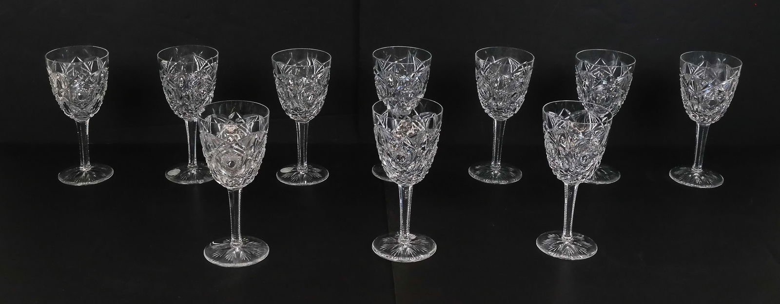Baccarat "Lagny" Crystal Red Wine Goblets, 10: Set of 10 Baccarat cut crystal "Lagny" pattern red wine goblet stemware, marks to base. [7.25" H x 3.25" Diameter]. Overall condition is good, chip to one rim. Property of and benefiting Columbia Univ