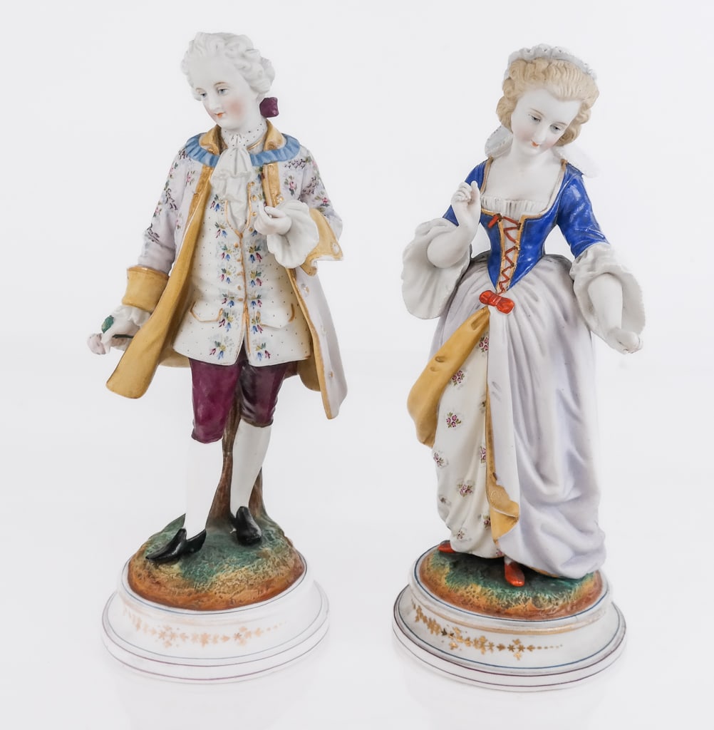 Pair of Bisqueware and Polychromed Figures: Pair of polychromed bisqueware figures, likely French, unmarked. [Taller: 10.5" H x 5" W x 4" D]. Condition is good with scattered normal wear and fading. CABINET BY ROOM 1