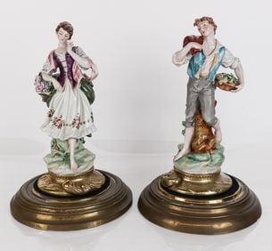 Pair of Porcelain Figures in Bell Jars