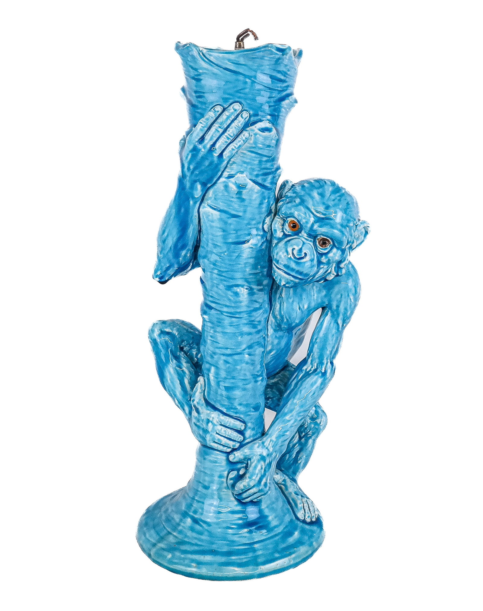 Turquoise Glazed Porcelain Monkey Form Lamp: Turquoise glazed porcelain lamp, 20th century, in the form of a monkey on a tree, weighted at interior. [18.25" H x 7" Diameter]. Condition is good to fair with craquelure; wires cut. From the Collect
