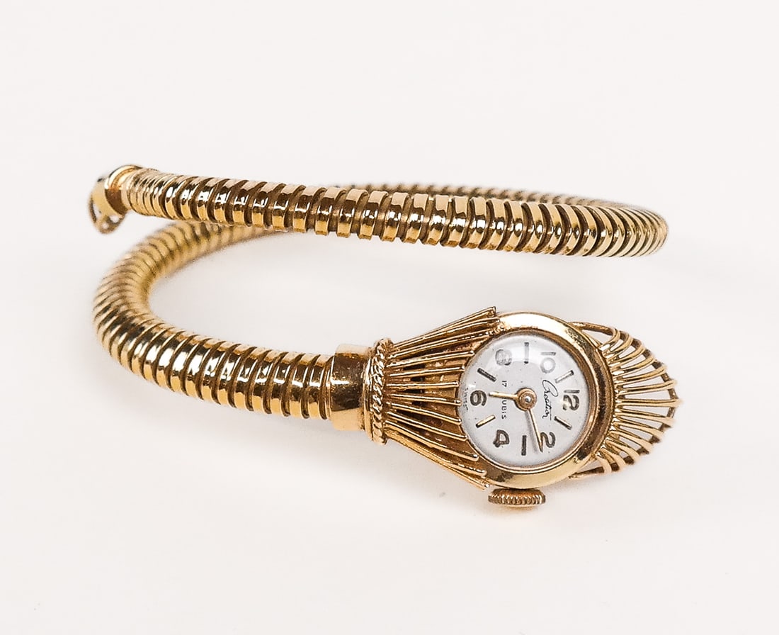 18K Yellow Gold Ladies Wristwatch: 18K yellow gold ladies wristwatch by Creation, "17 Rubis", Swiss-made, having a snake forming the band. 16.6 grams total weight. In working condition.