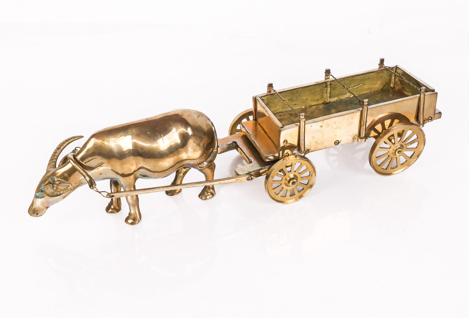 Brass Figurine Desk Ornament: Brass figurine of an ox drawn cart as a desk ornament, last quarter of the 20th century. [In to parts, all together: 4" H x 14" L x 3.75" W]. Overall is fair/good, scratches, commensurate with age, so