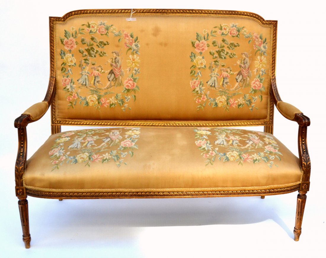 Louis XVI-Style Gilt Wood Loveseat: Features carving throughout, open arms, and aubusson-type upholstery. [54 1/8" W x 22" D x 41 3/4" H (20 1/8" H to seat]